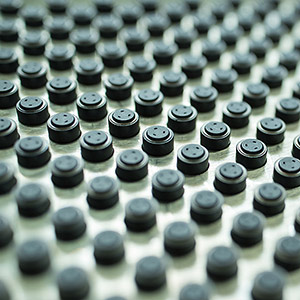 Magnetic armature coated with dry film lubricating coating.
