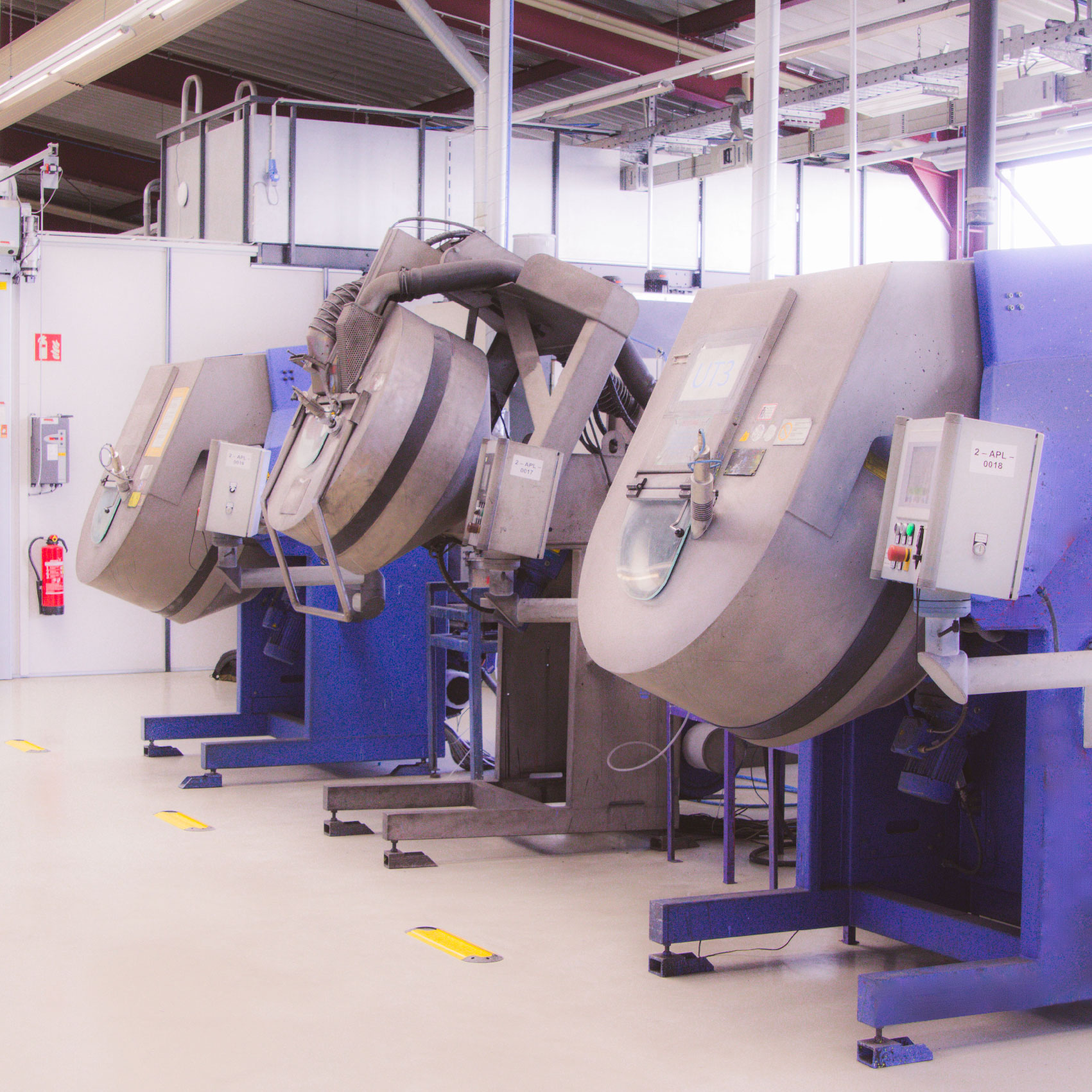 Mass coating of elastomers with bonded coating.